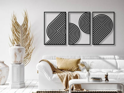 Modern living room with white sofa, decorative pillows, and abstract wall art.